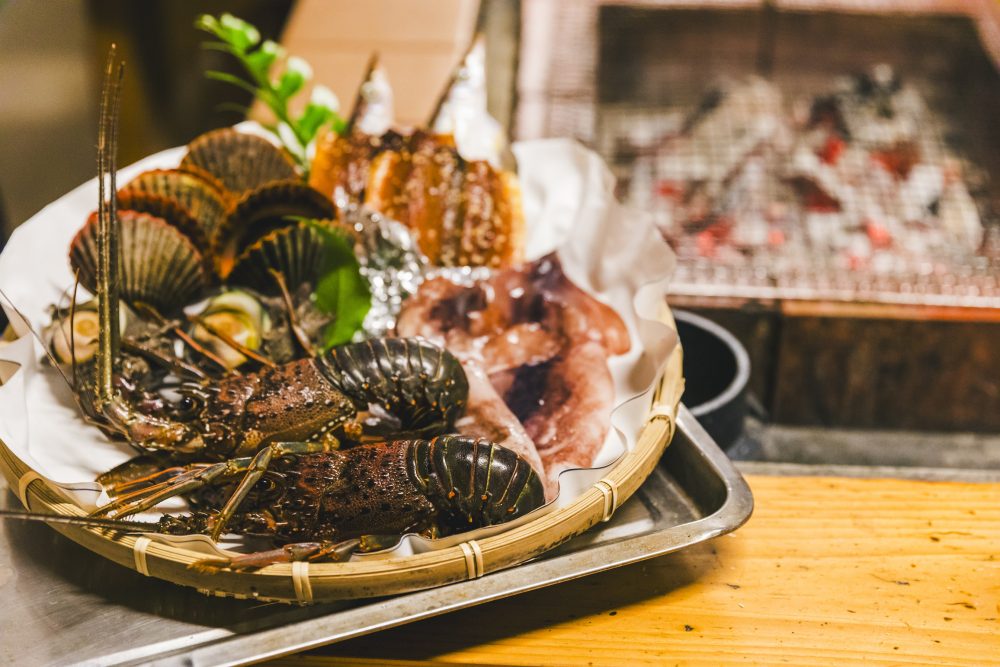 Seafood lunch served by divers in the hearth