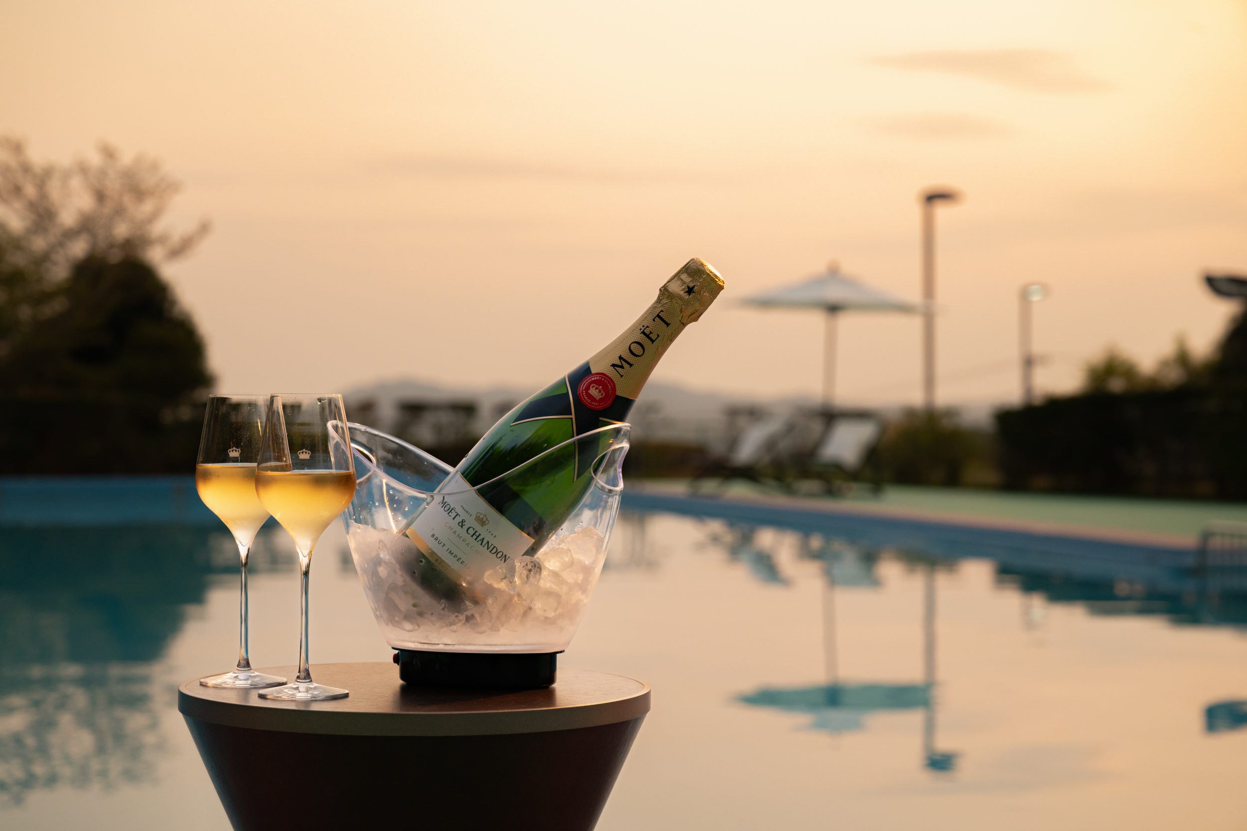 Toast with "Moe e Chandon" luxuriously in the night pool!